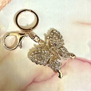 Gold tone butterfly rhinestone hang tag/keychain